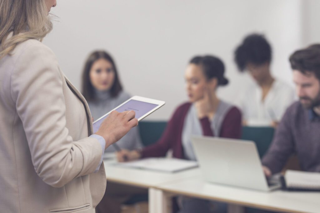 Woman Holding Tablet Classroom
