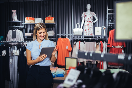 Retail employee looking at a mobile device