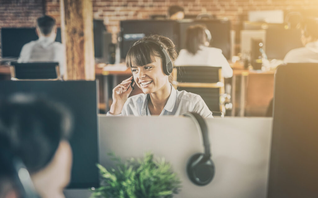 Call center agent speaking into a headset.