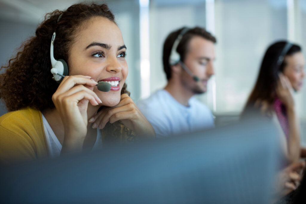 Customer Service call agents on their headsets.