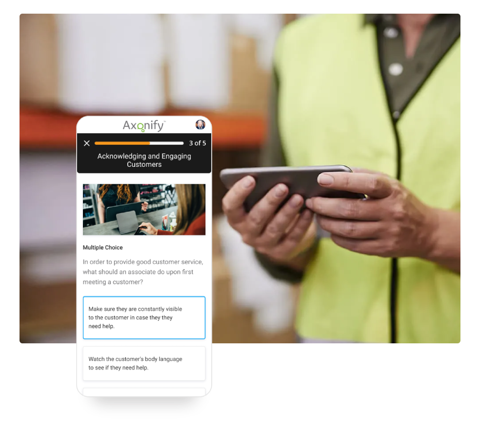 Screenshot of onboarding progress in Axonify overlapping photo of warehouse employee in yellow safety vest