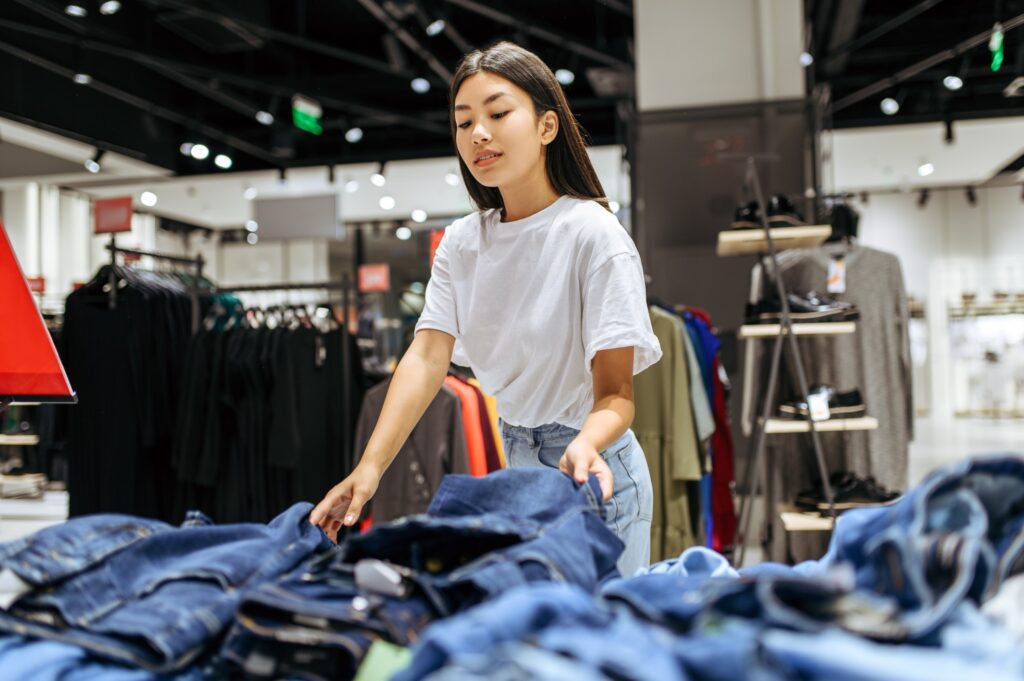 Retail Employee Folding Clothes