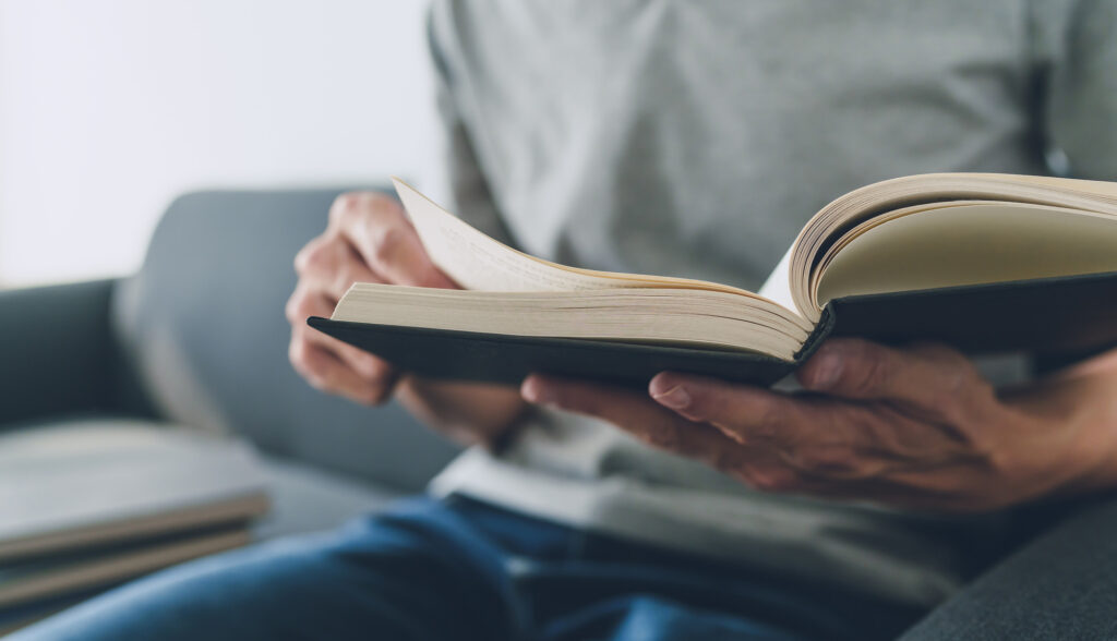 Man sitting and reading a book