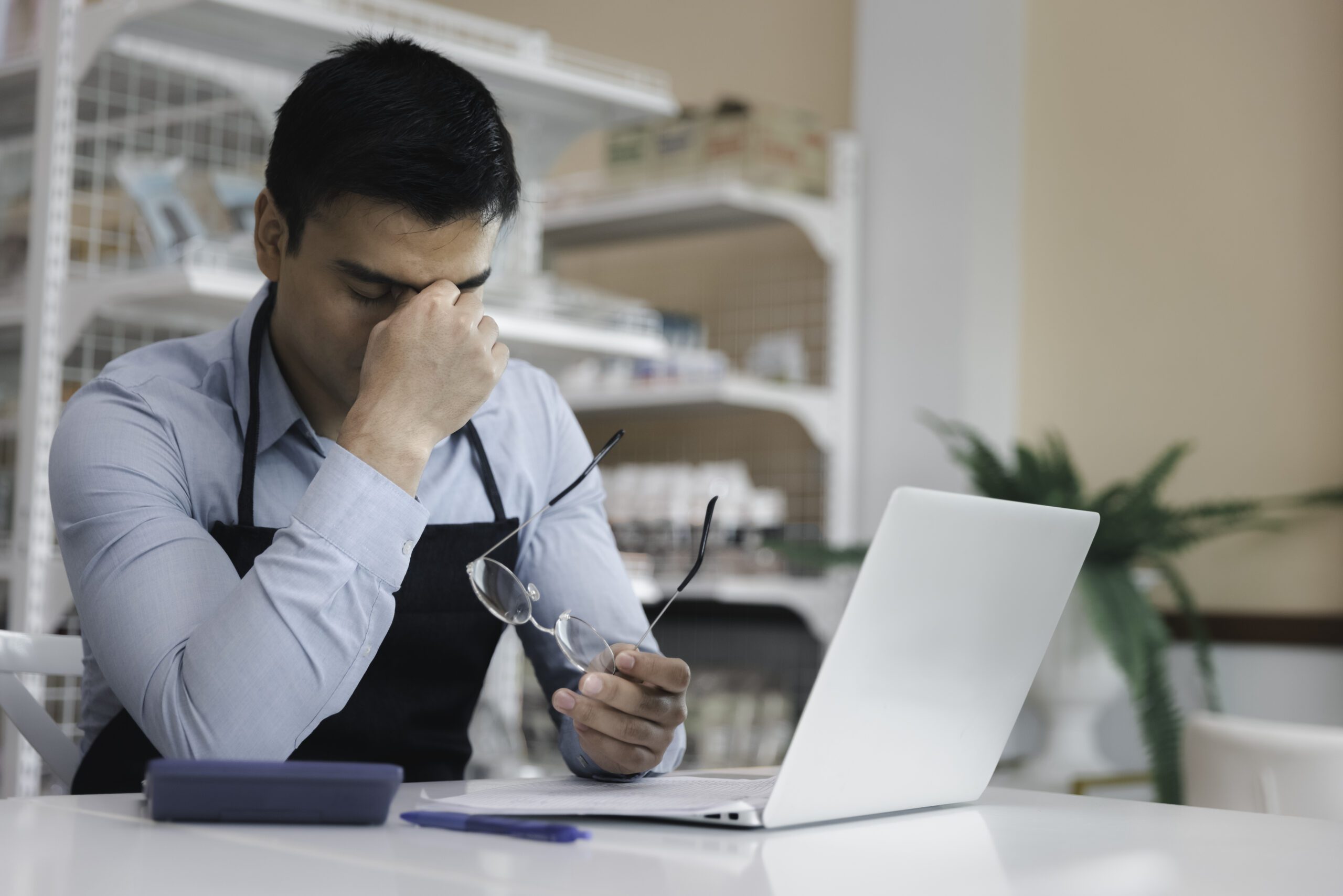 Male entrepreneur store owner feel stressful regret and sad in business crisis during covid pandemic, Business commercial bankruptcy concept with copy space