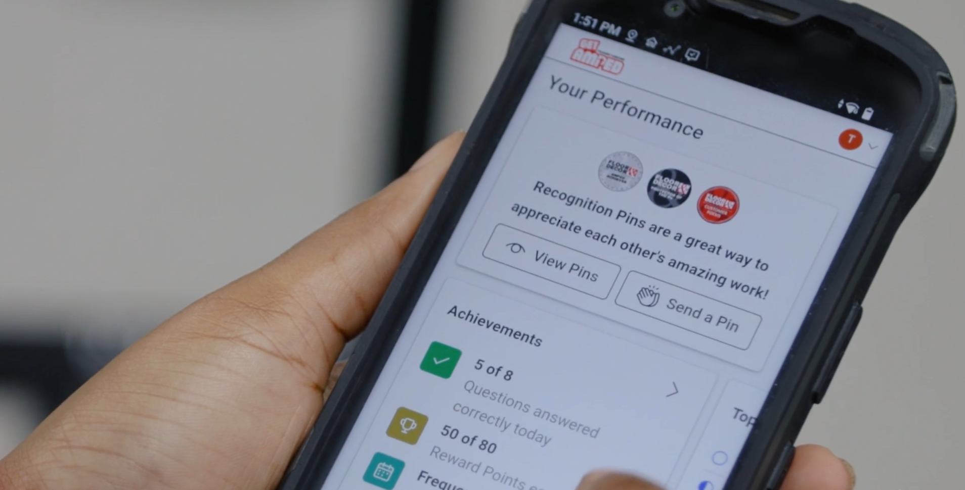 Handheld screen showing Axonify