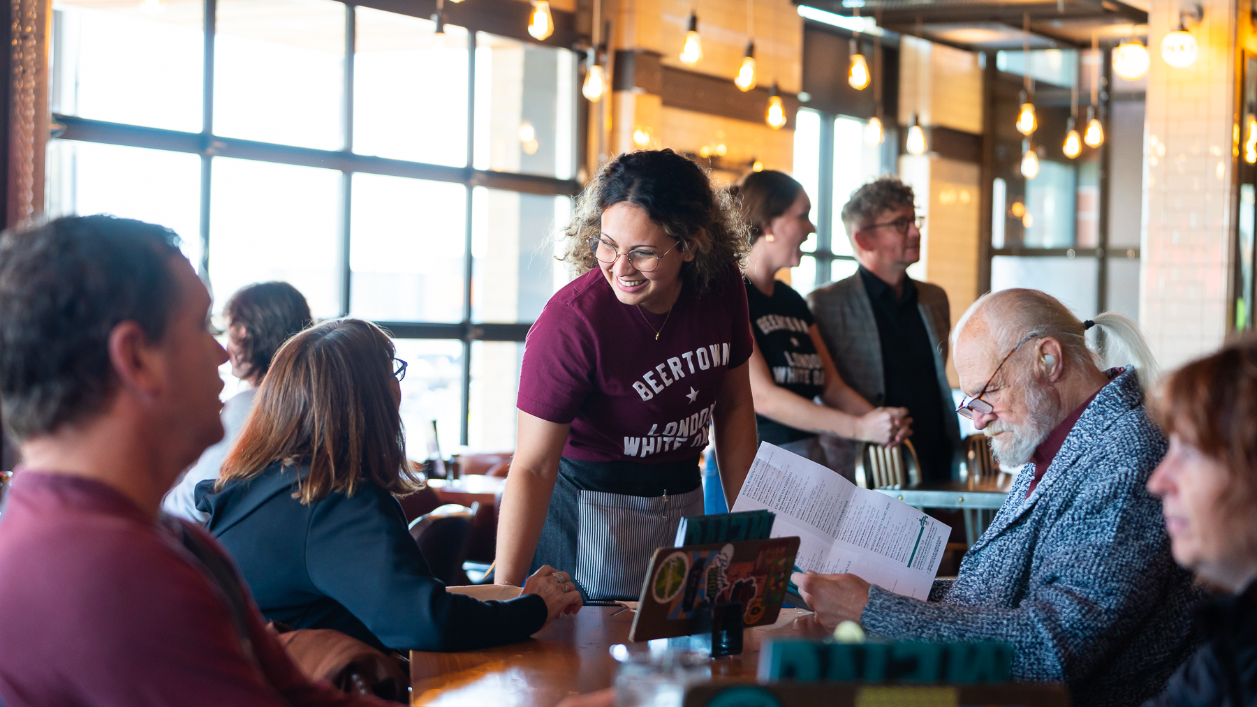 Restaurant employee taking order