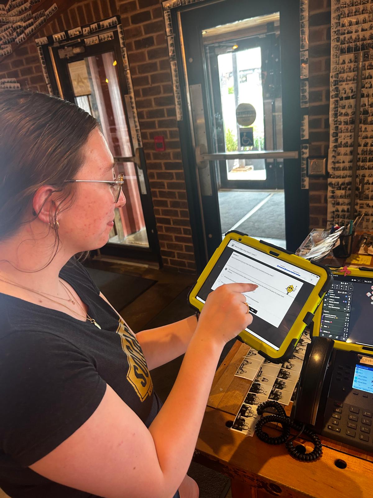 Restaurant employee using iPad