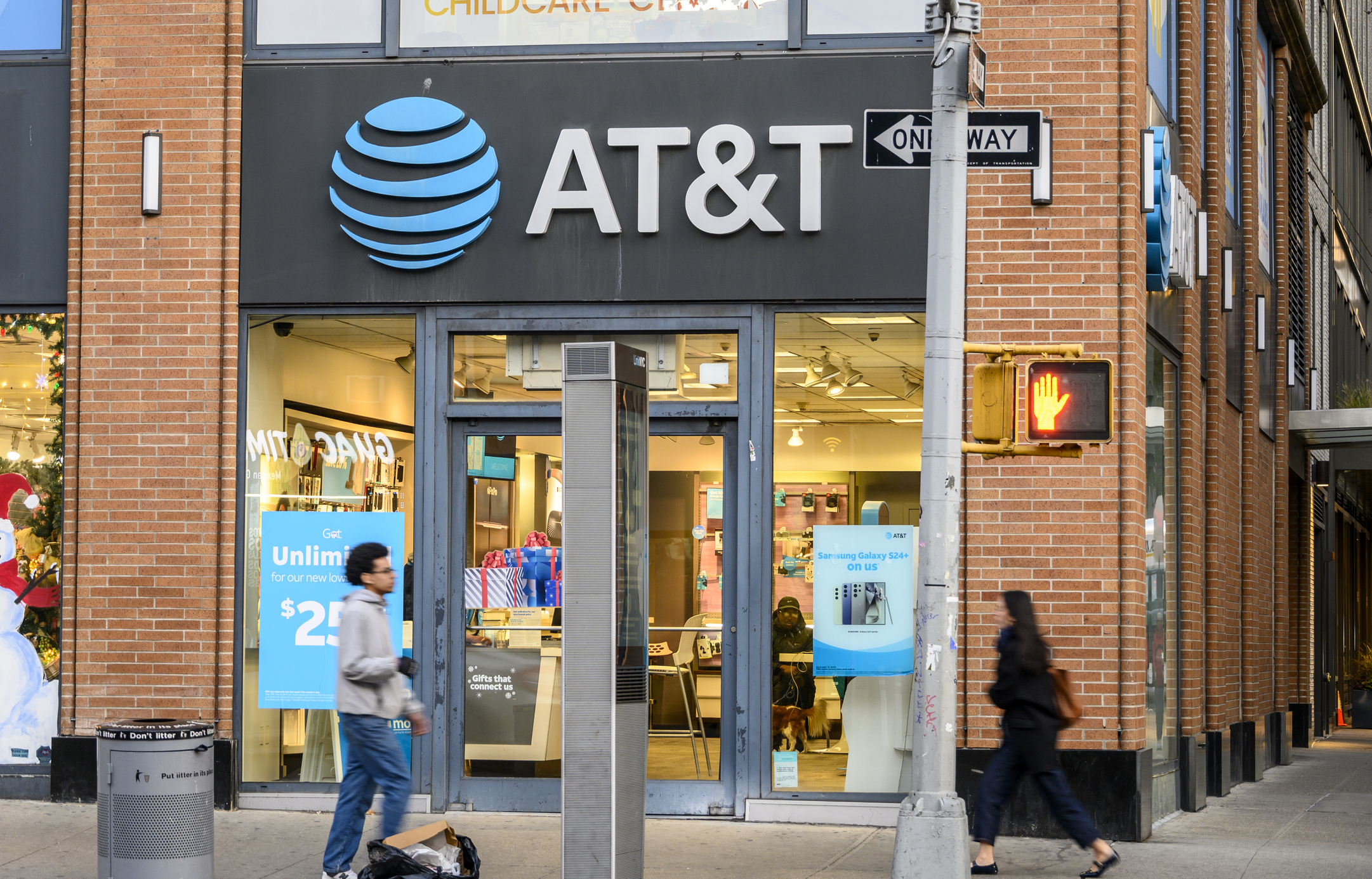 At&t Retail Store Front and people walking on the pavement
