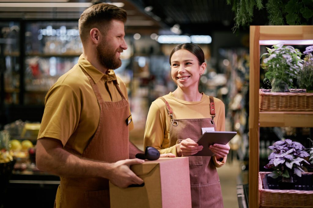 Smiling Grocery Store Employees Working Together