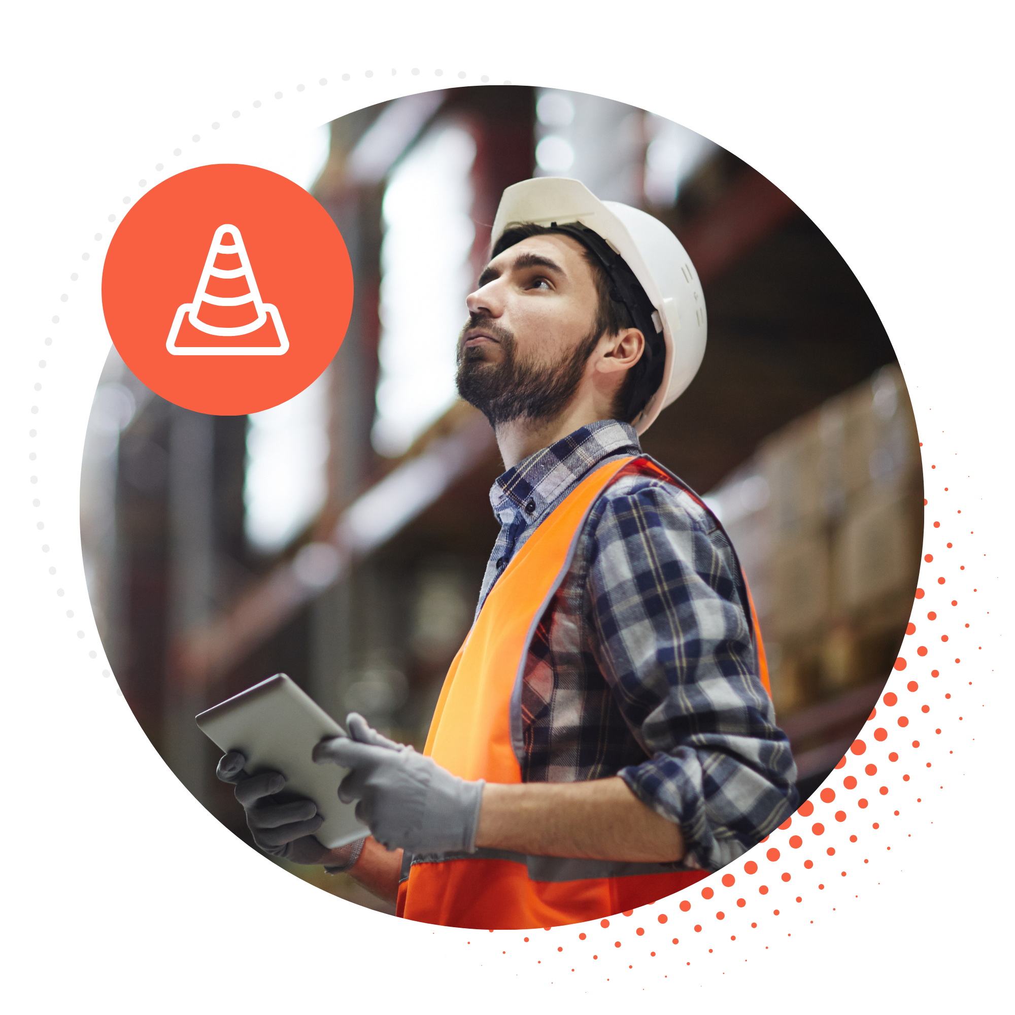 A warehouse worker in a hard hat and hi‑vis vest looking up while holding a tablet among storage racks
