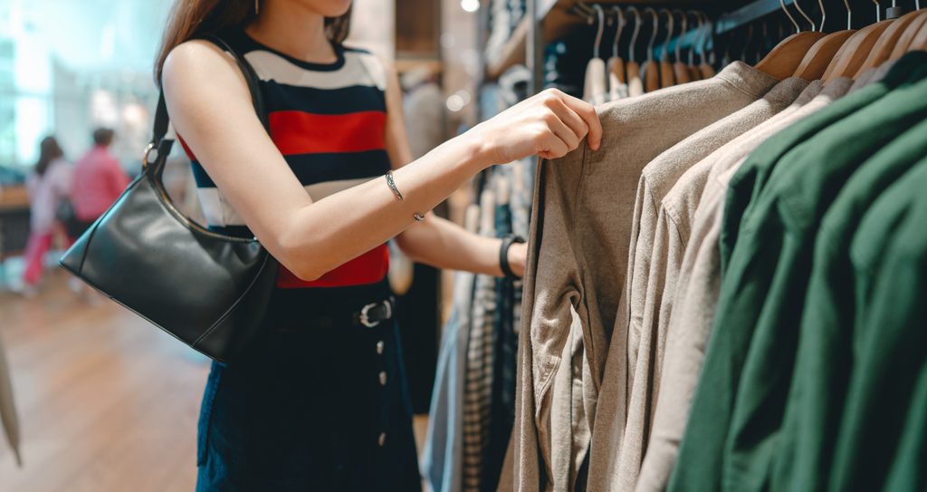 Asian Woman Shopping Clothes In Fashion Shoping Mall